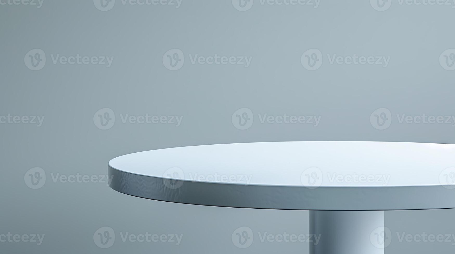 A minimalist white round tabletop with a gray background, suitable for product displays. photo