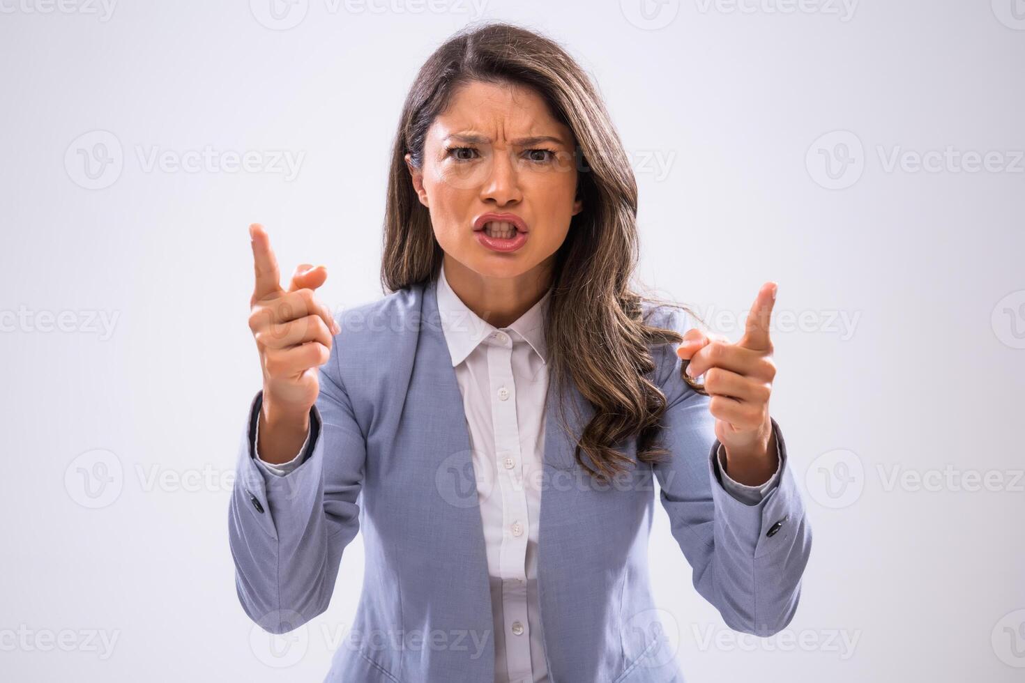 Portrait of angry businesswoman who threatens. photo