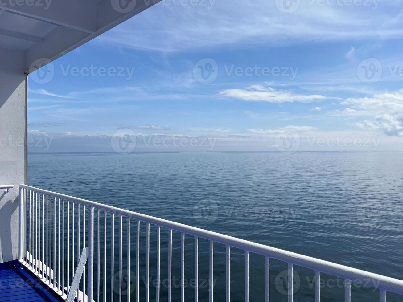 Sea view from the deck of a cruise ferry ship. Calm water without waves photo
