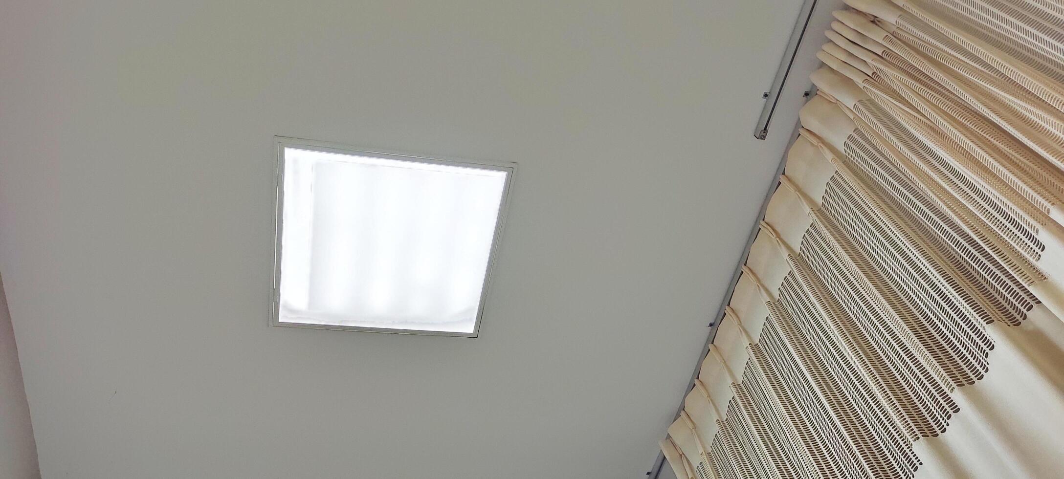 Background view of the ceiling of a hospital patient's room from the perspective of a bedridden patient. Clinical healthcare recovery treatment room ward. photo
