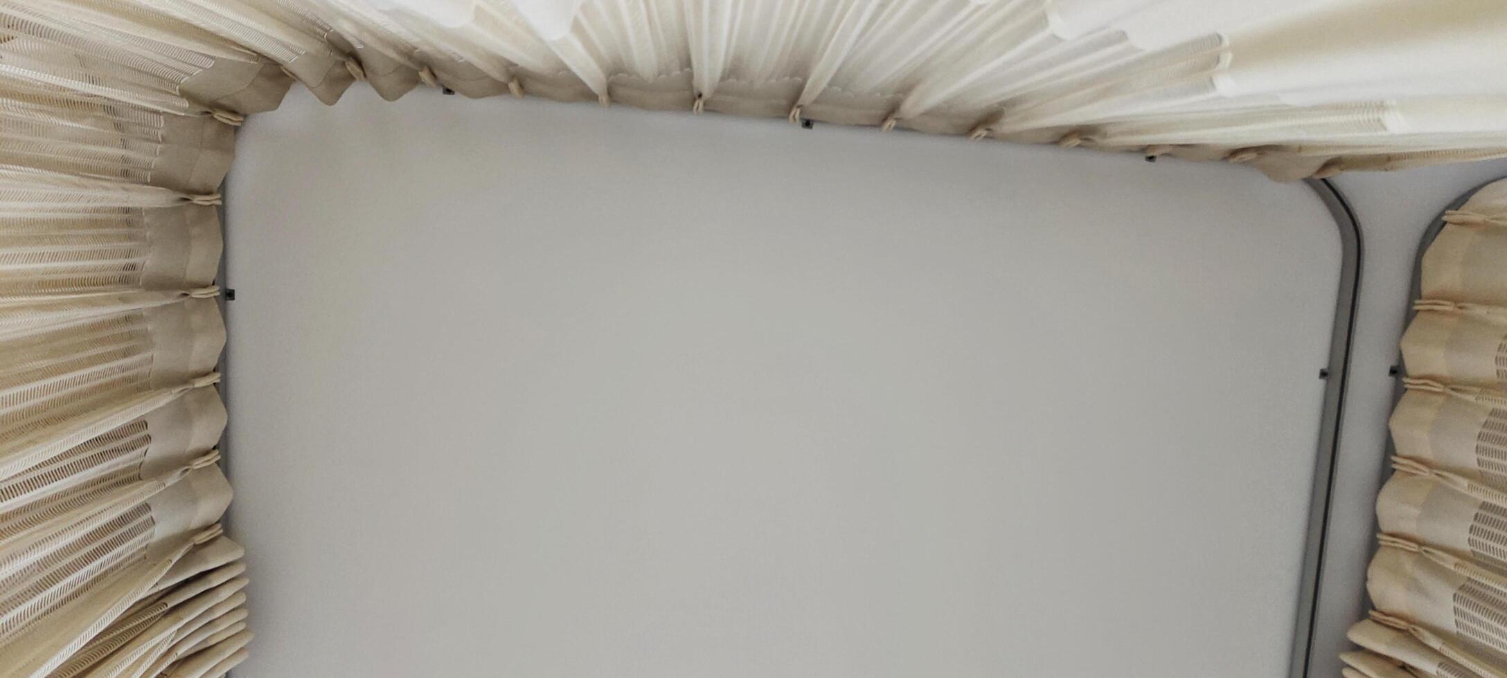 Background view of the ceiling of a hospital patient's room from the perspective of a bedridden patient. Clinical healthcare recovery treatment room ward. photo