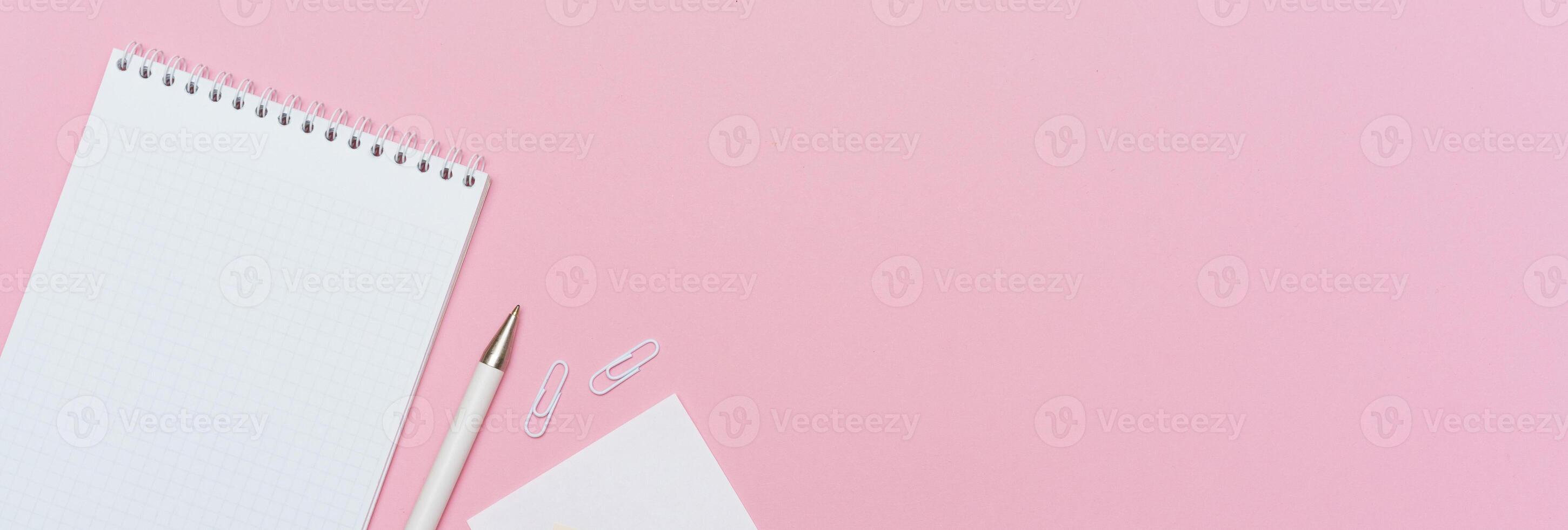 Workspace concept for school or office. Flat lay with an open notebook photo