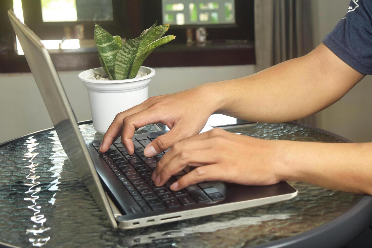 Asian people are using laptops to access internet banking photo