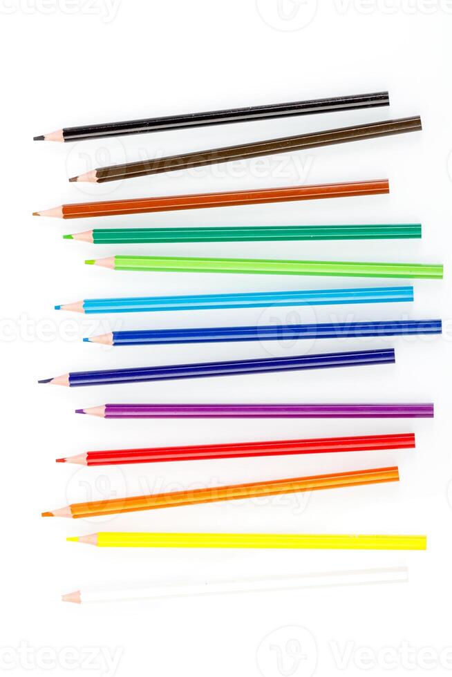 macro multicolored pencils on a white background photo