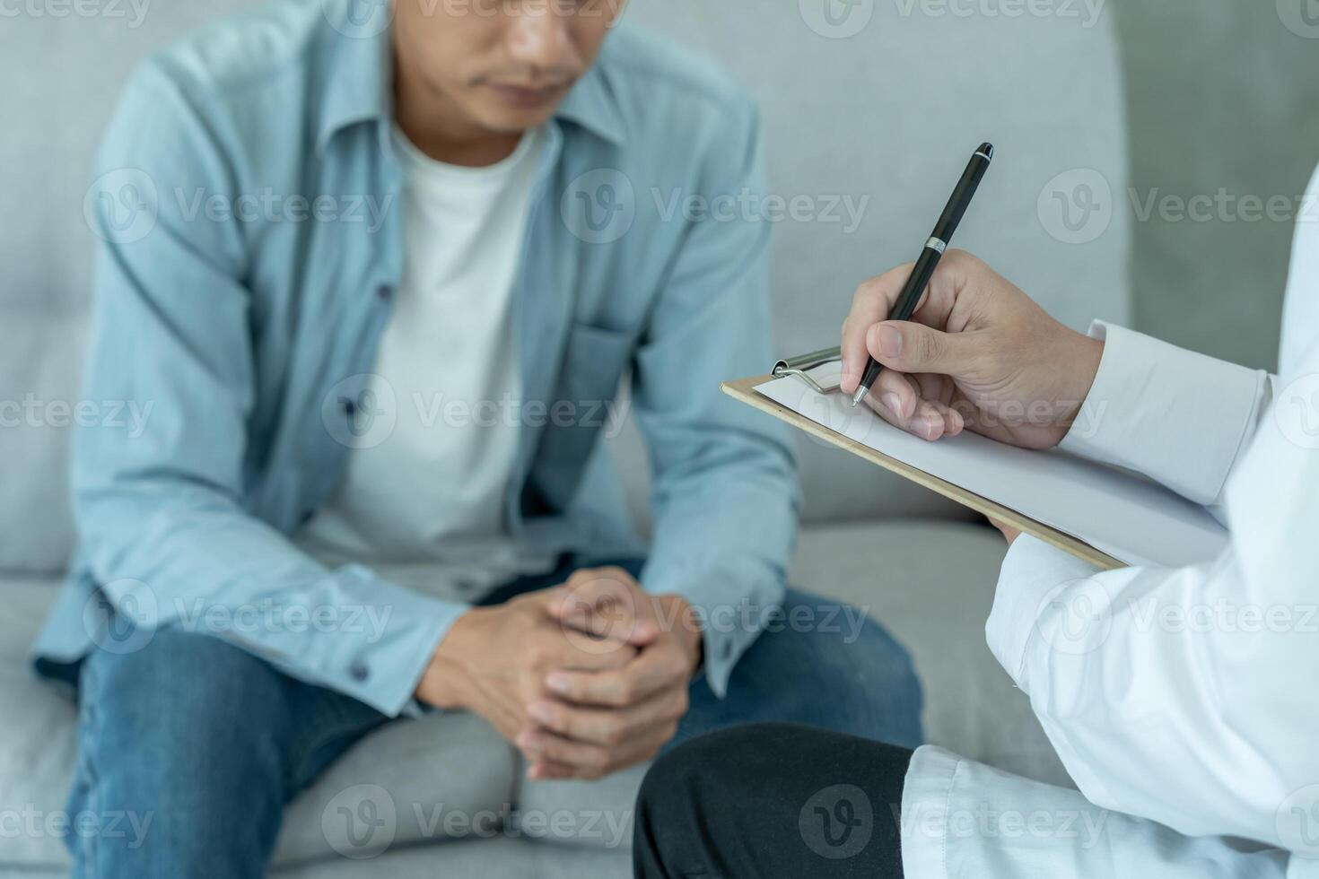 man with mental health problems is consulting. psychiatrist is recording the patient's condition for treatment. encouragement, love and family problem, bipolar , depression patient, protect suicide photo