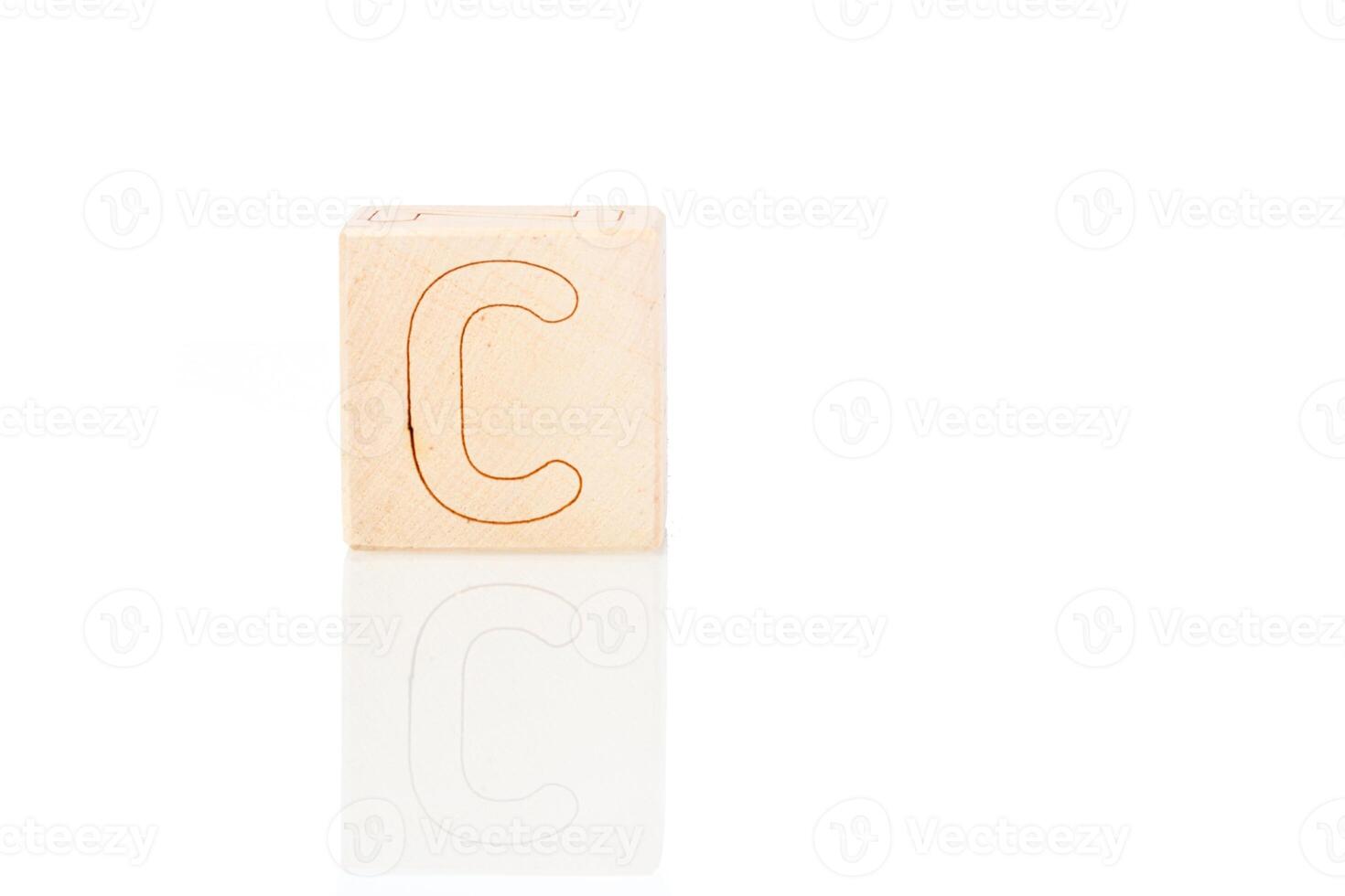 Wooden cubes with letters C on a white background photo