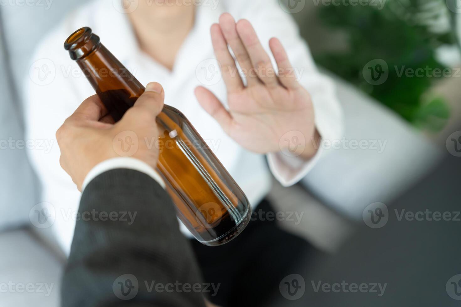 man refuses say no and avoid to drink an alcohol whiskey , stopping hand sign male, alcoholism treatment, alcohol addiction, quit booze, Stop Drinking Alcohol. Refuse Glass liquor, unhealthy, reject photo