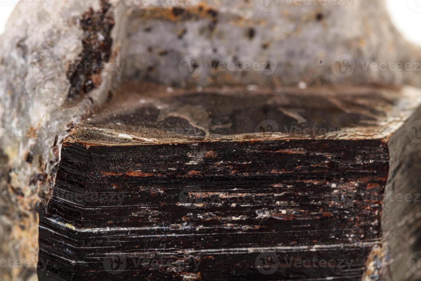 Macro of a mineral stone Vesuvianite on a white background photo