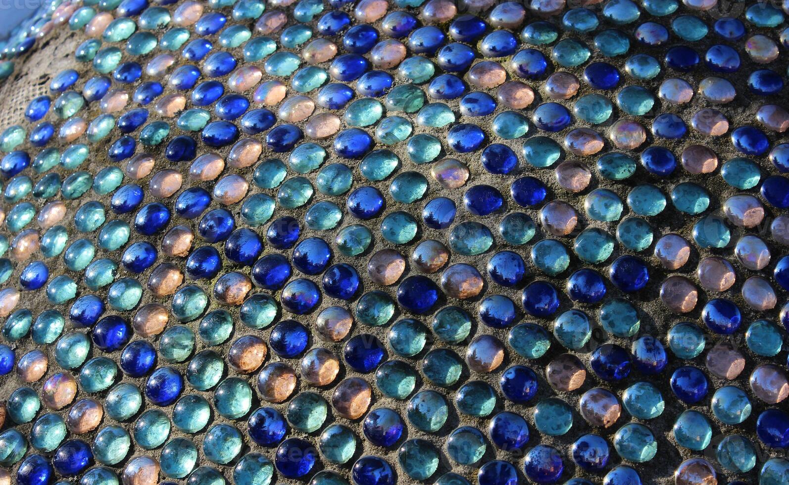 Glass Abstract Round Mosaic Pattern Of Penny Round Mosaic Glass In Concrete Basement photo