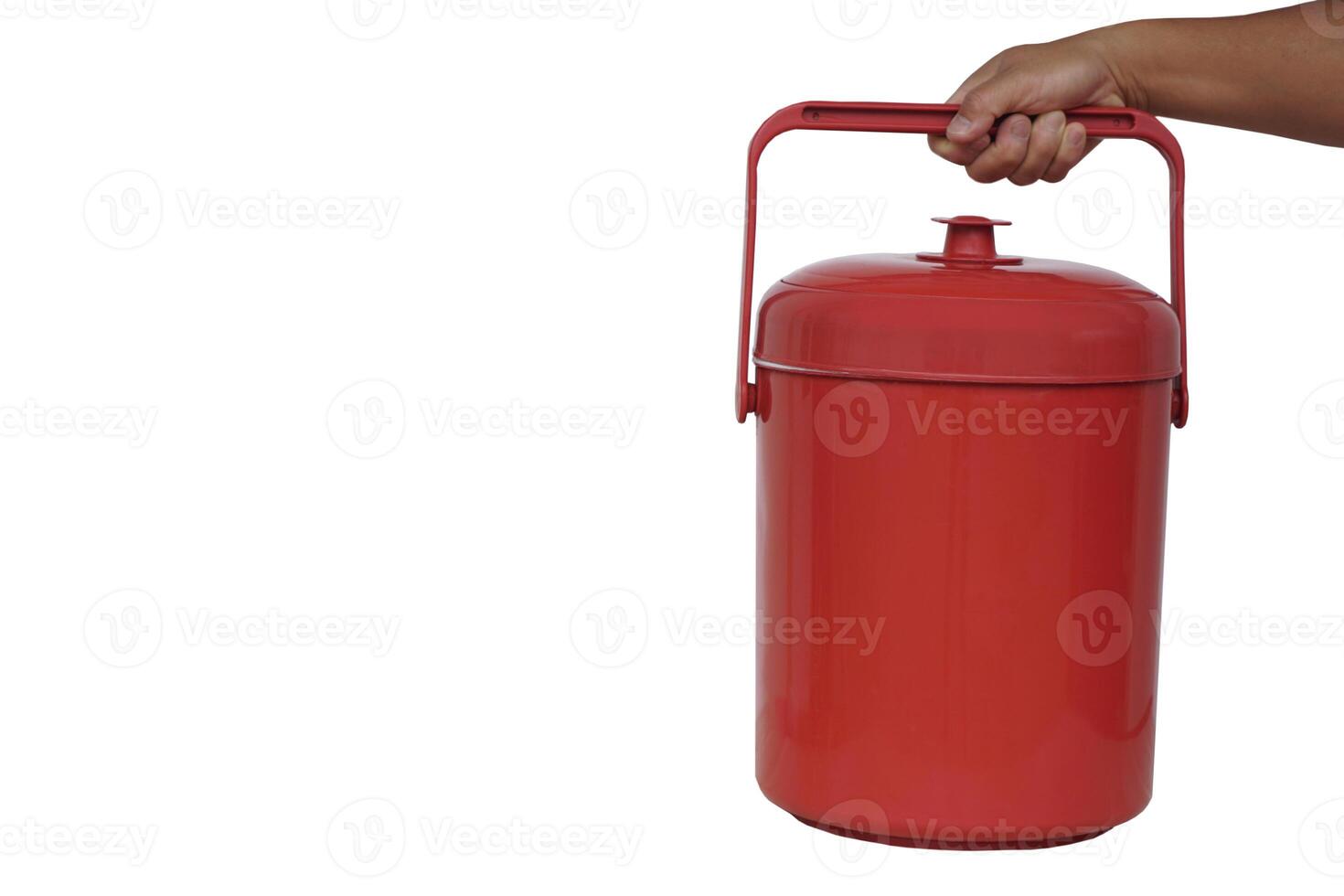 Close up hand hold red plastic bucket cooler. White background. Concept, kitchenware container for keep cool of ice, prepare for mix in beverages in party or picnic. Easy and convenient to carry. photo