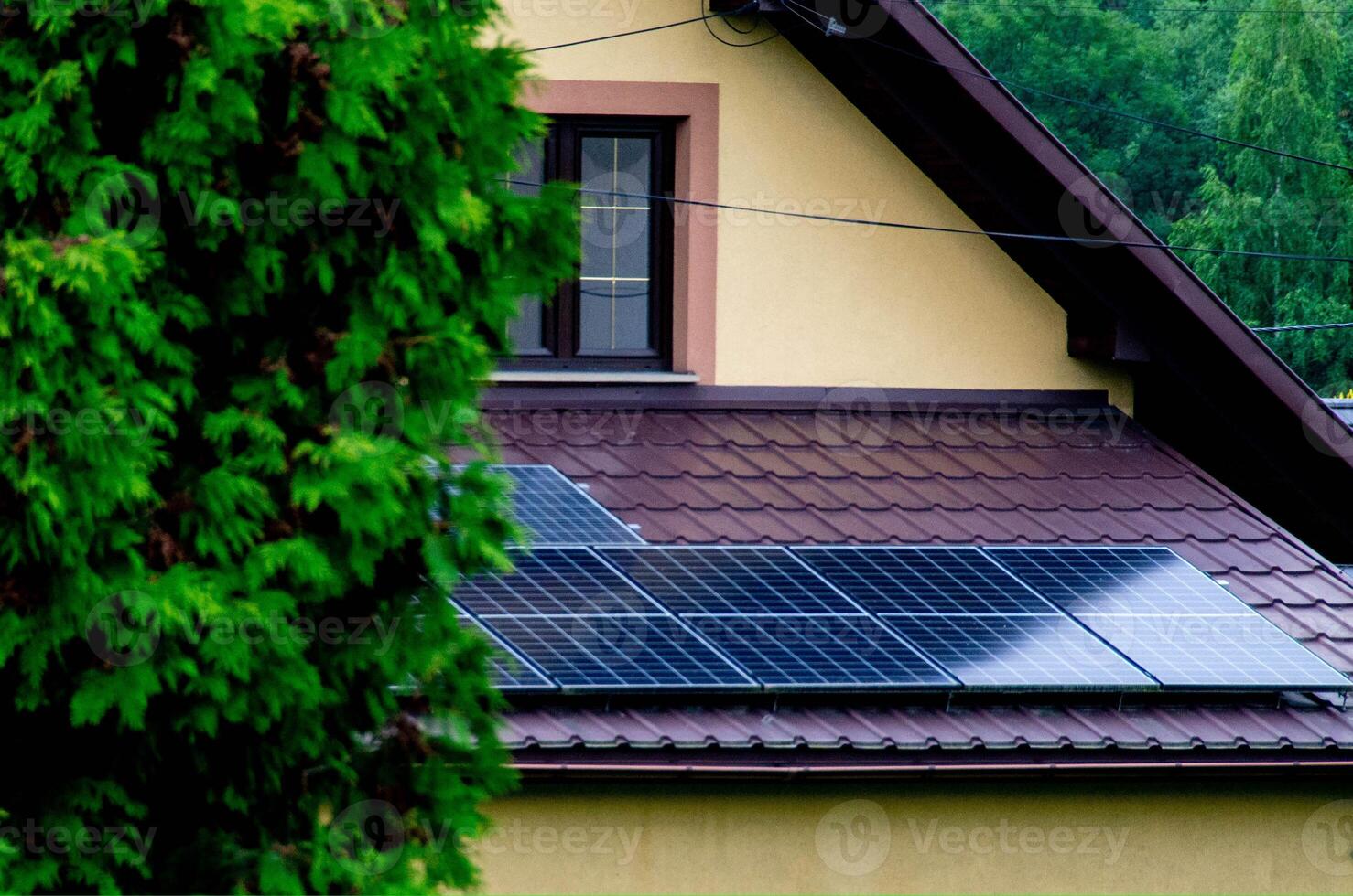 Historic farm house with modern solar panels on roof and wall photo