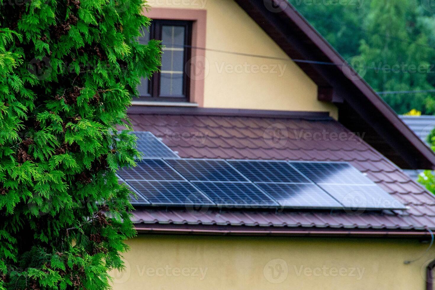 Historic farm house with modern solar panels on roof and wall photo