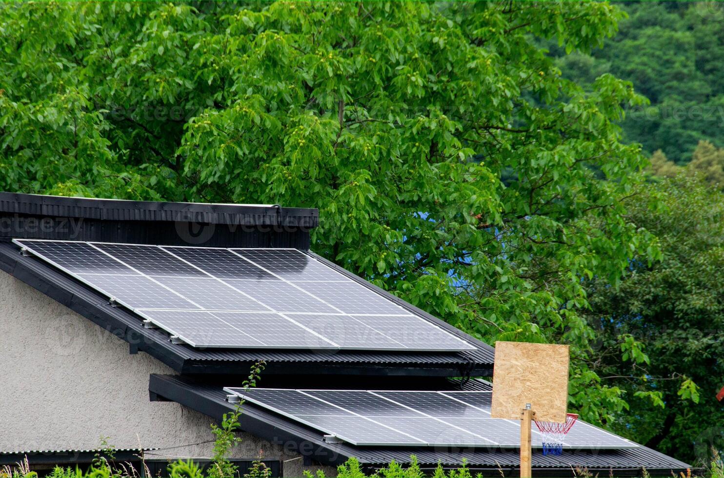 Historic farm house with modern solar panels on roof and wall photo