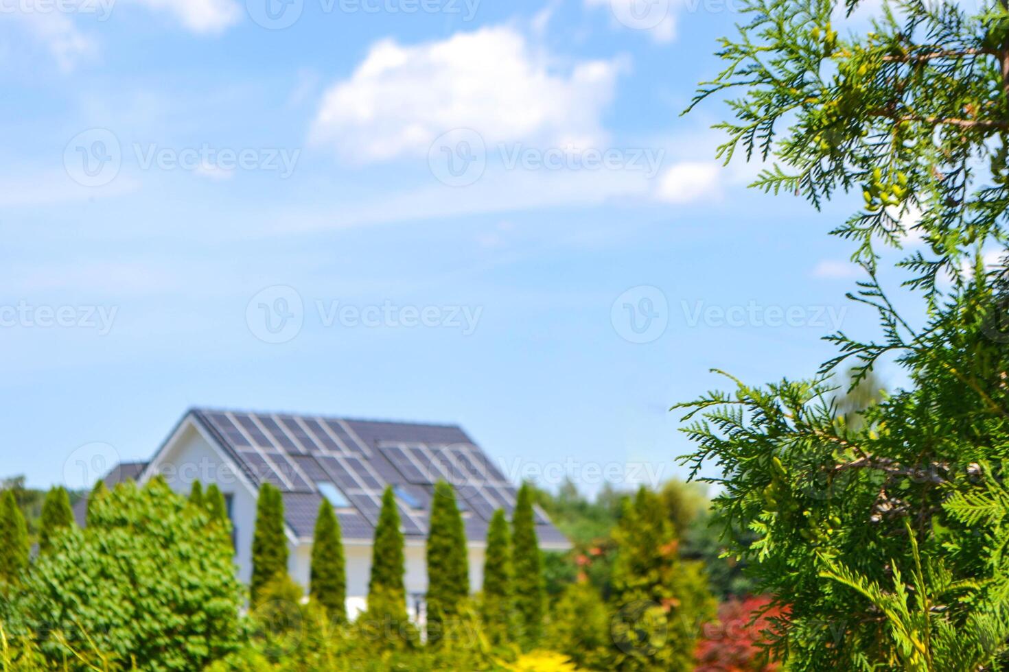 Historic house with modern solar panels on roof photo