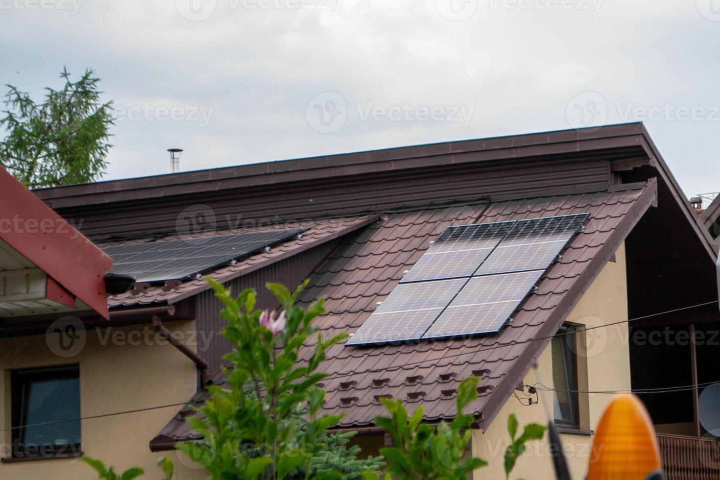 Historic house with modern solar panels on roof photo