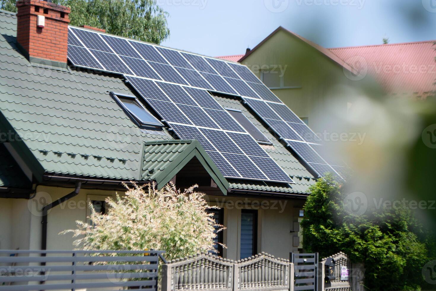 Historic house with modern solar panels on roof photo