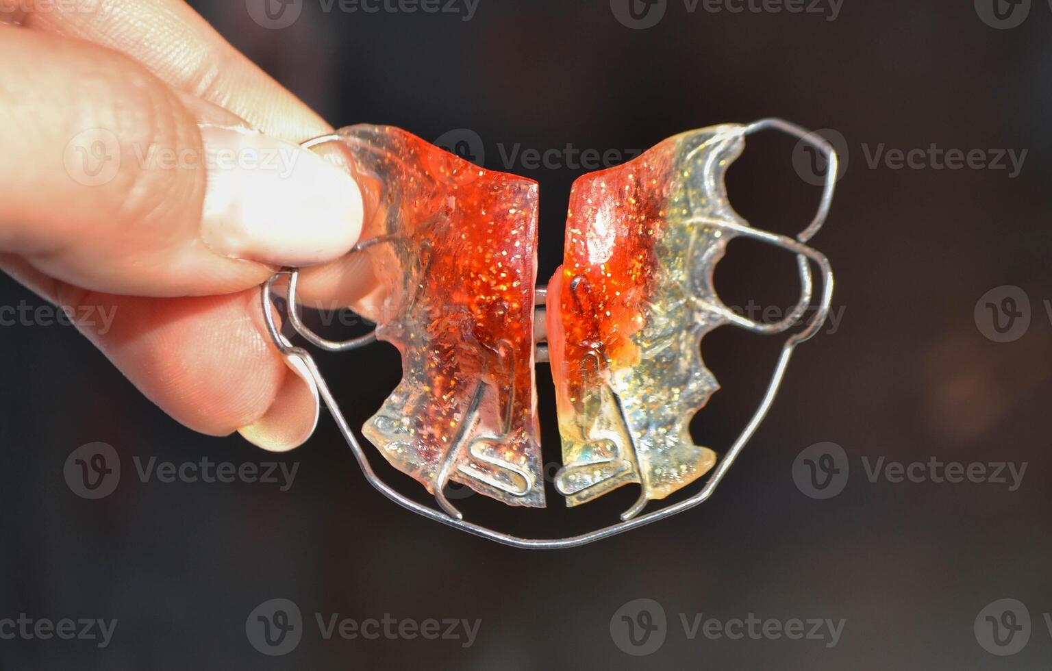 Red Retainer on a white background.Already used And is closely imaged. photo