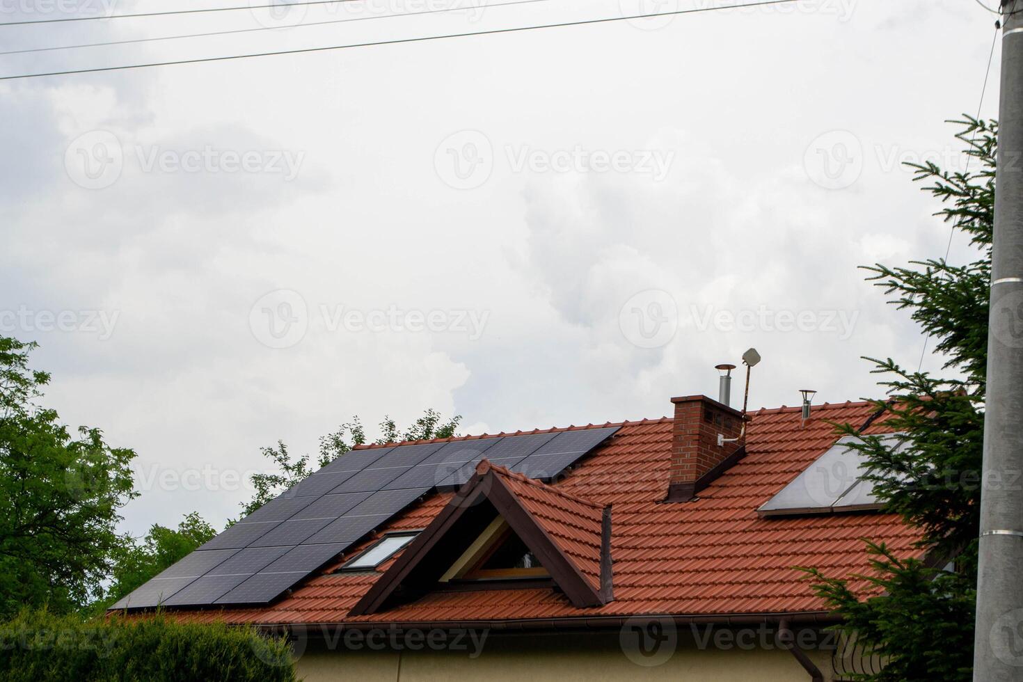 Historic house with modern solar panels on roof photo