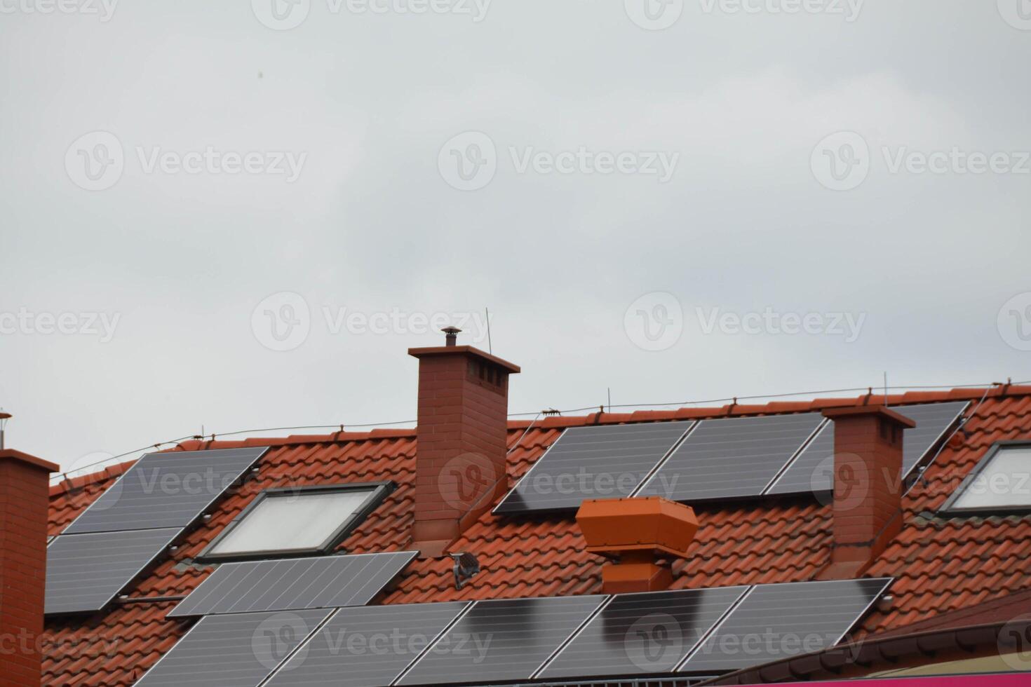 Installing a Solar Cell on a Roof. photo