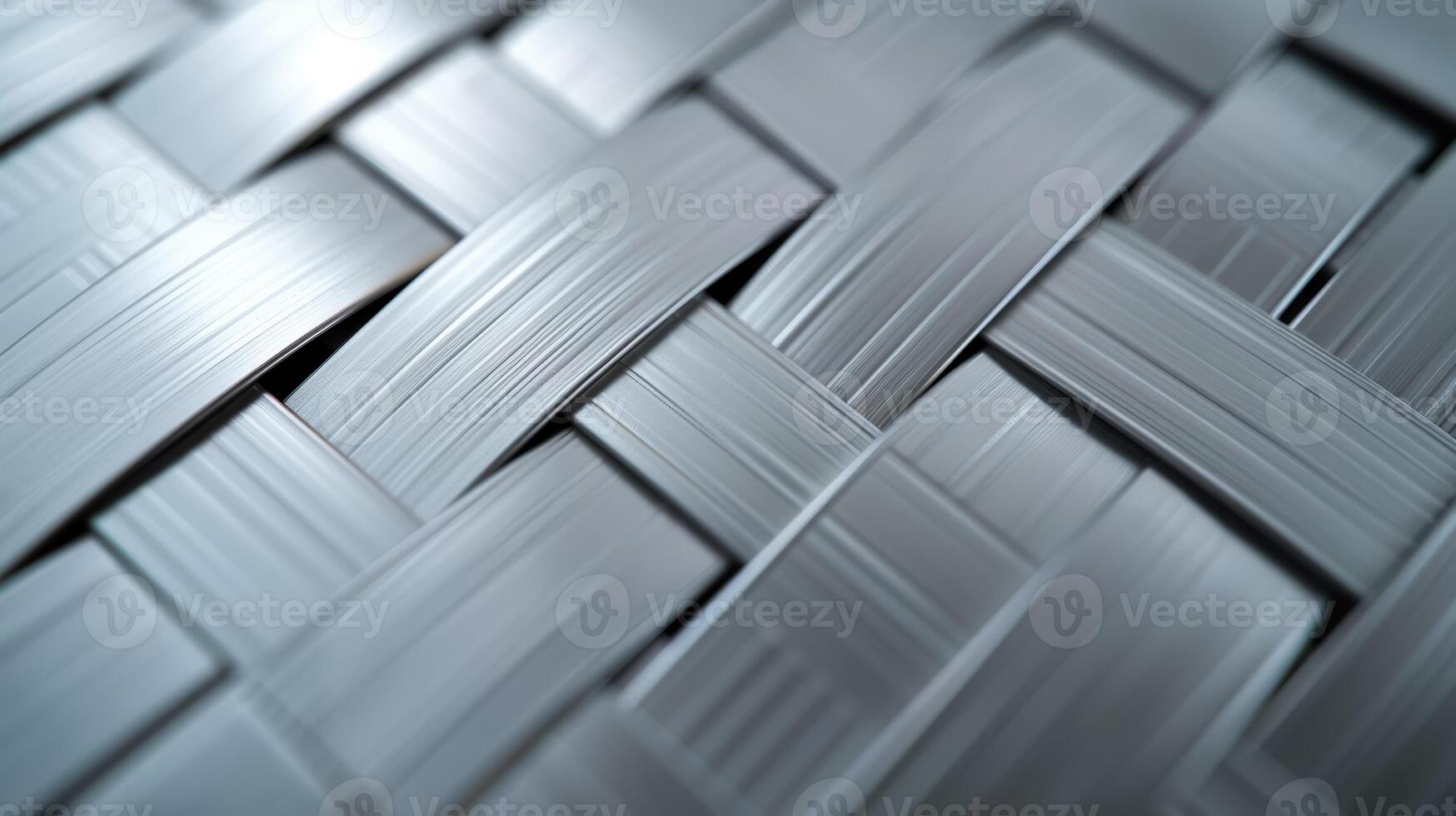 Brushed metal background with a crosshatch pattern textured and polished finish silver and light gray tones photo