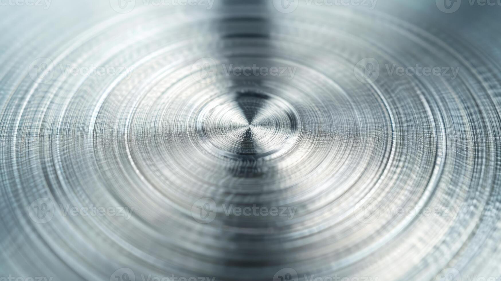 Metal background with a brushed circular pattern polished and shiny finish silver and light gray tones photo