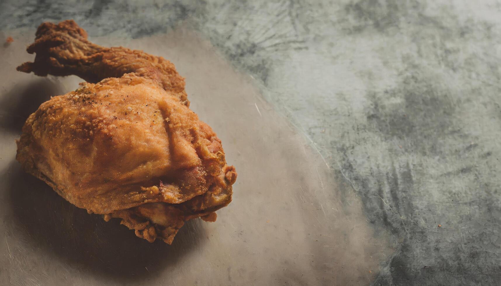 Copy Space image of Classic Southern Fried Chicken on dark background. photo