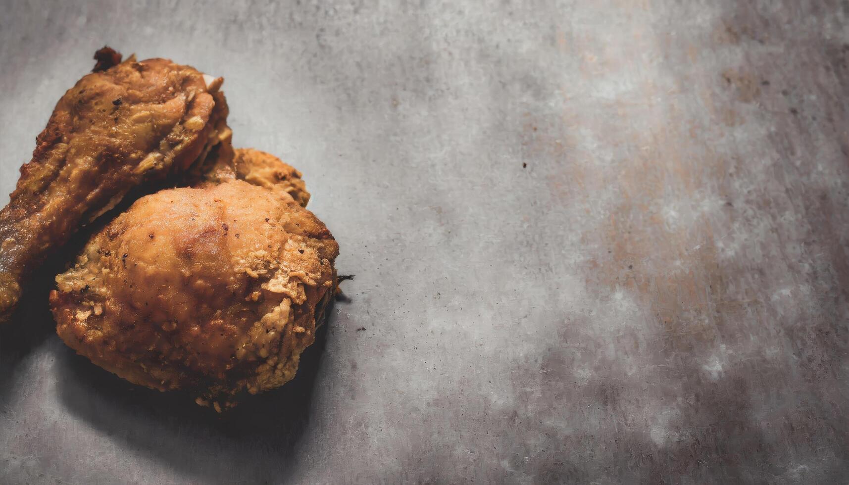 Copy Space image of Classic Southern Fried Chicken on dark background. photo