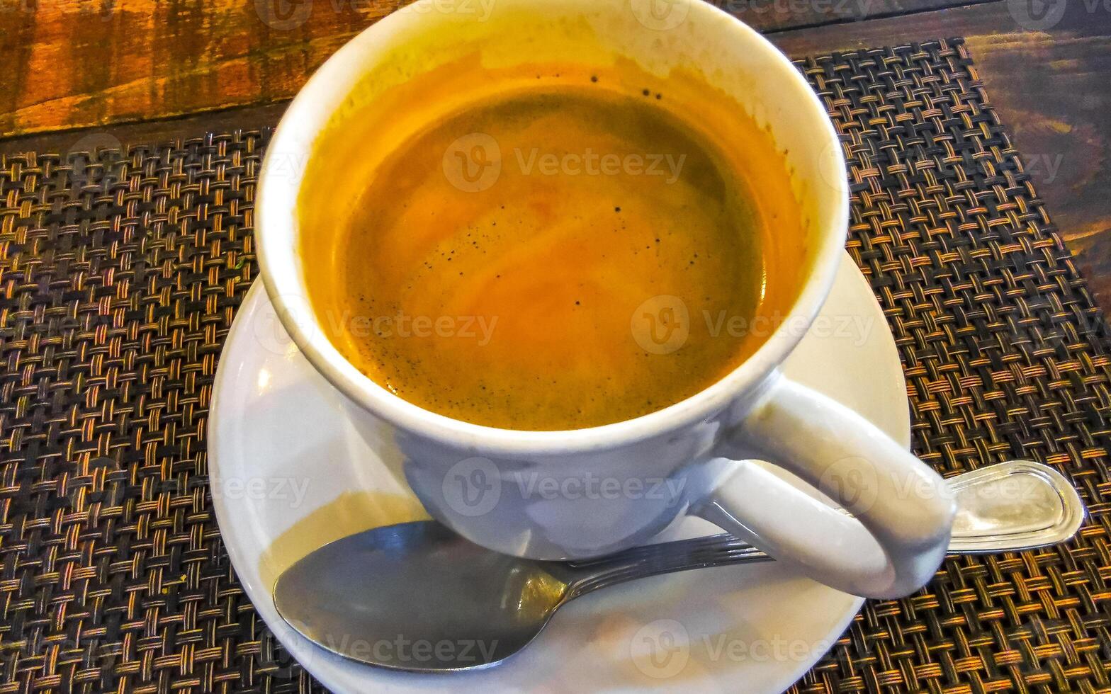 Cup of americano black coffee in restaurant cafe in Mexico. photo