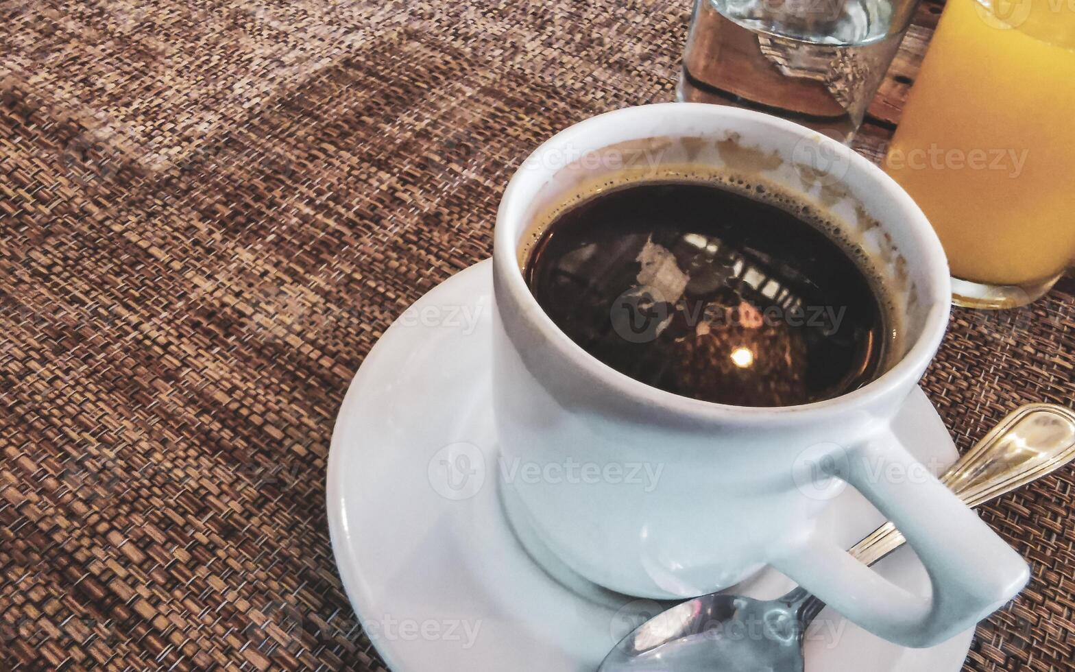 Cup of americano black coffee in restaurant cafe in Mexico. photo