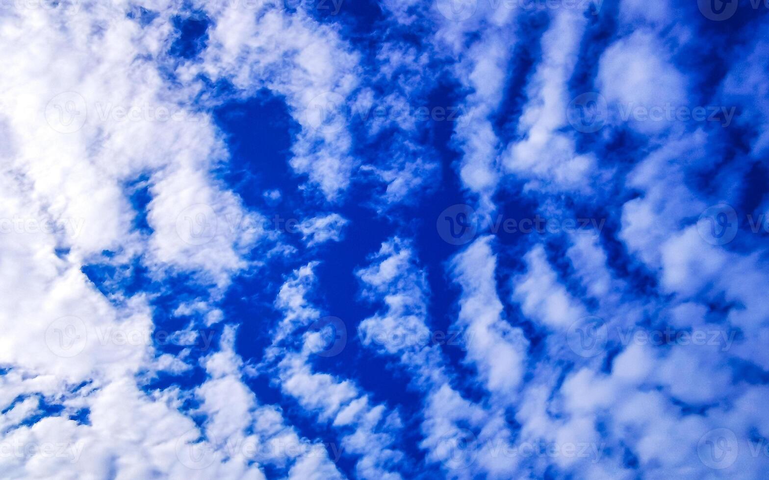 Blue sky with chemical chemtrails cumulus clouds scalar waves sky. photo