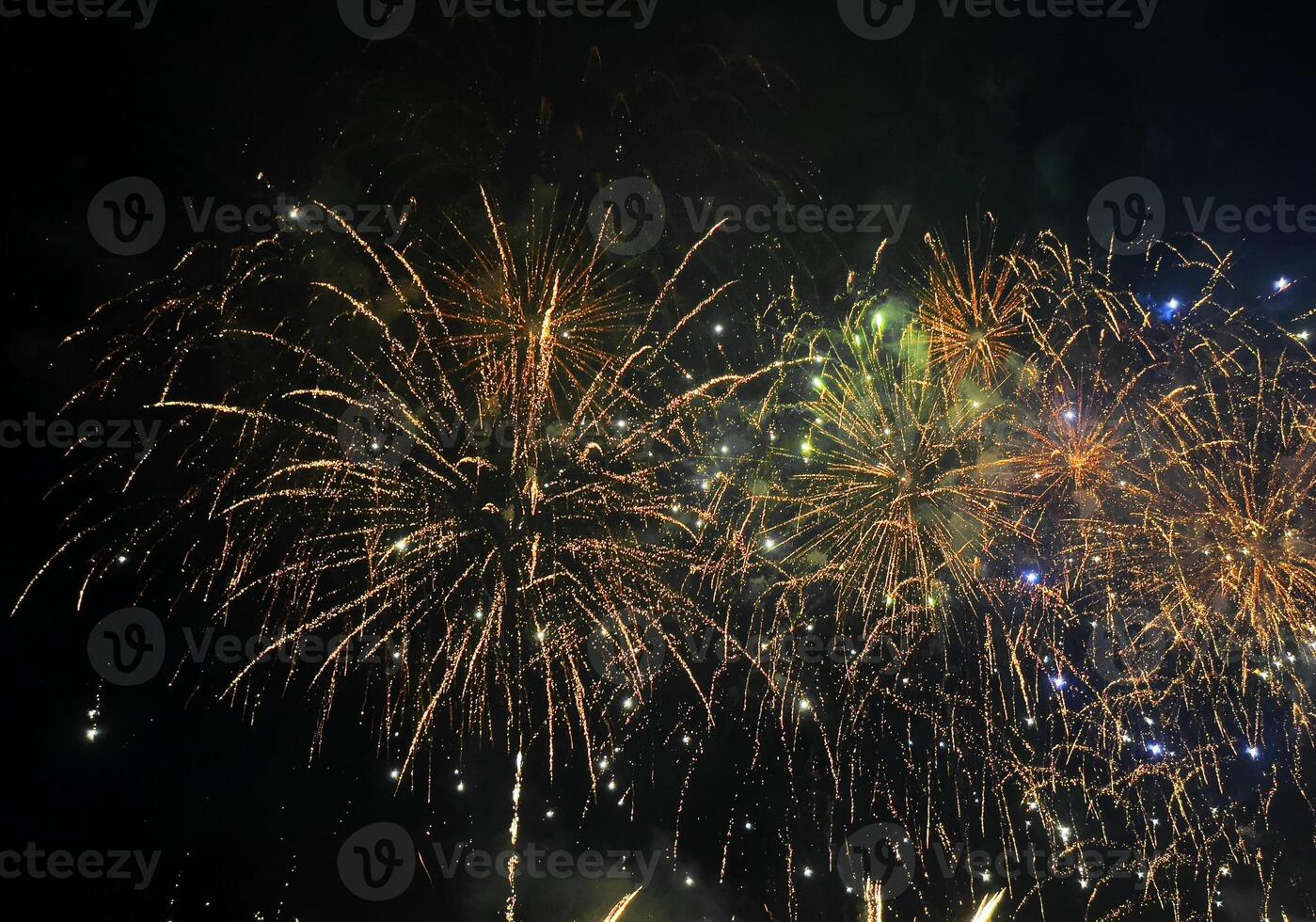 a large group of fireworks is lit up in the sky photo