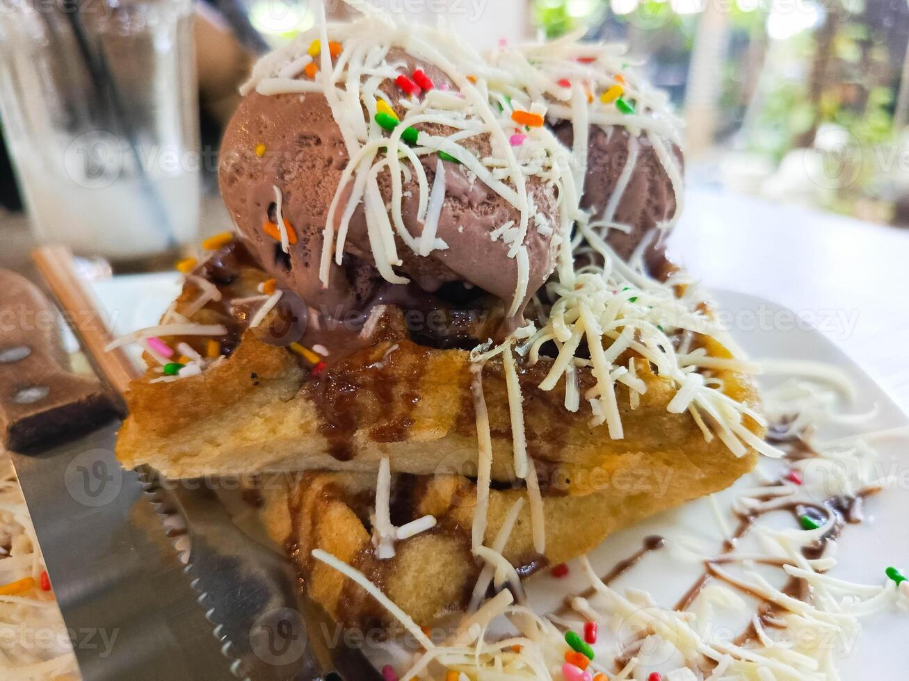 photo of a very appetizing waffle ice cream filled with cheese and chocolate toppings, usually used for regular menu covers as well as recipe book covers