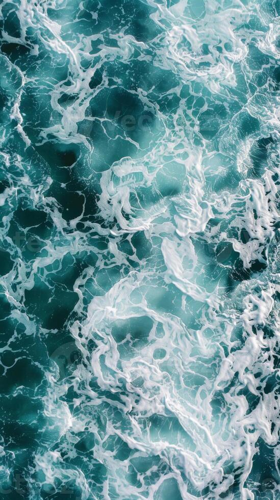 Overhead view of crashing turquoise waves photo