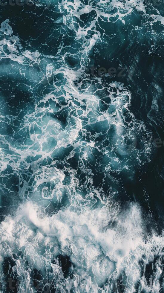 Ocean waves crashing with foam and turquoise water photo