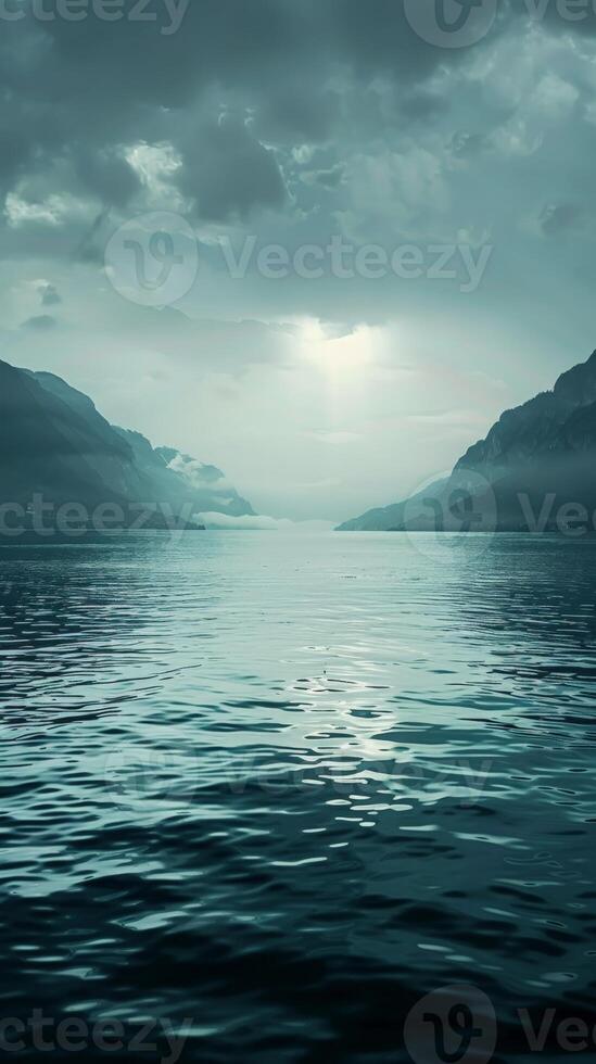 Calm water reflects a cloudy sky photo