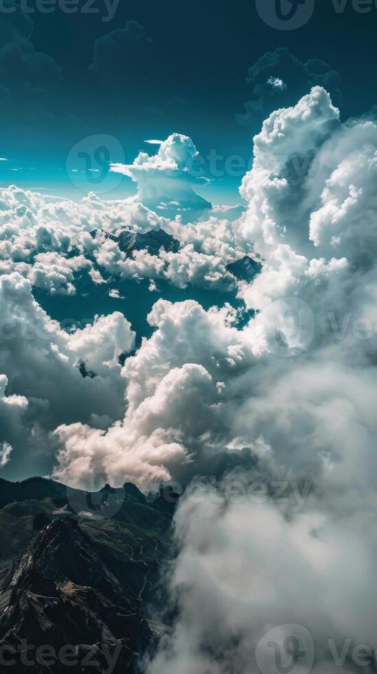 White clouds drift over mountain peaks photo