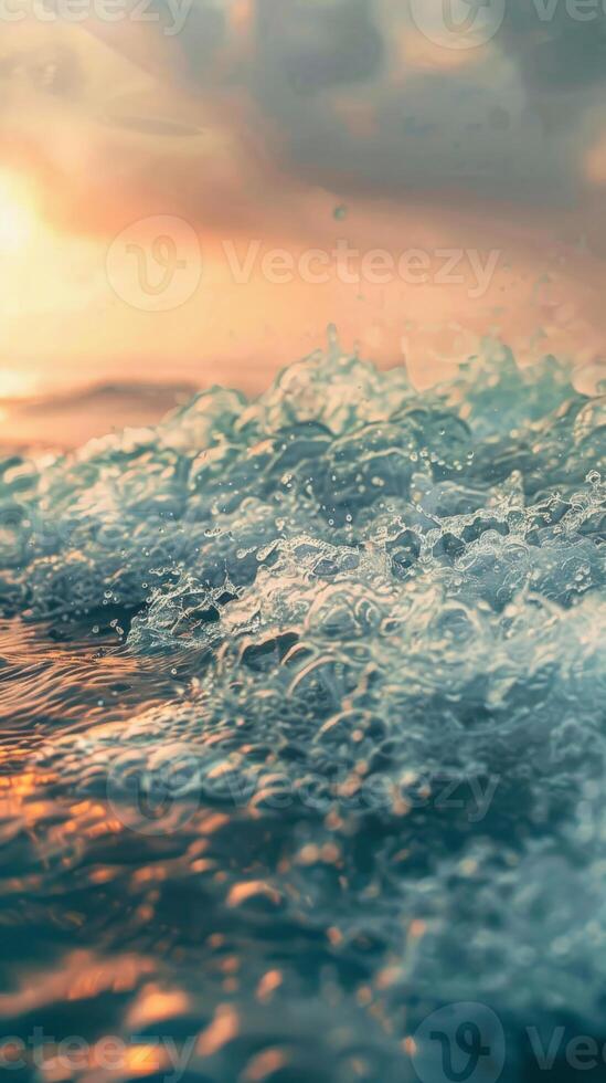 Close-up of foamy ocean waves with a golden sunset in the background photo