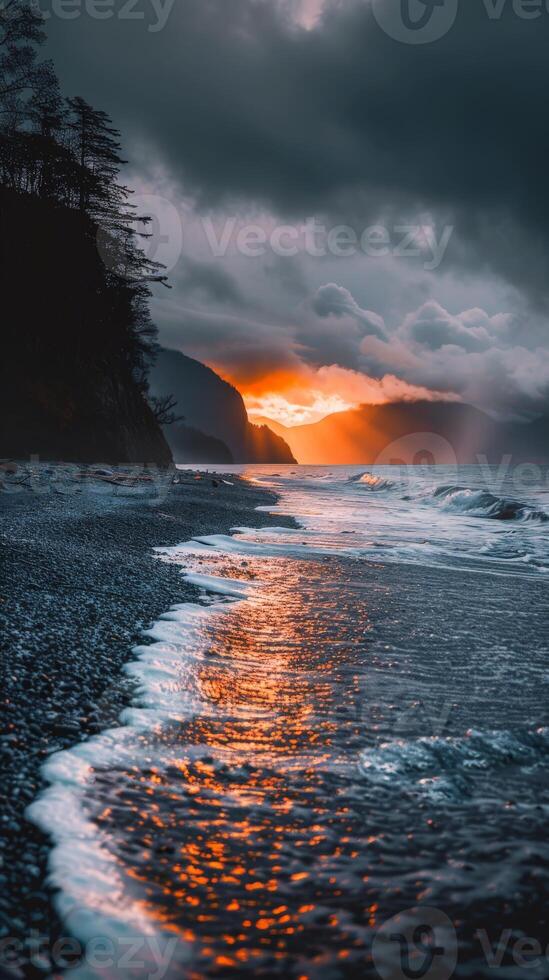 Sunset sky reflects in the ocean waves photo