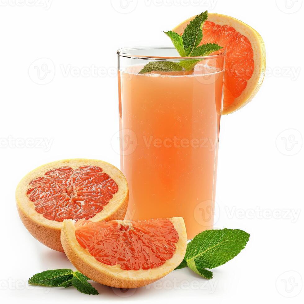 A tall glass of grapefruit juice with fresh mint garnishes and grapefruit slices photo