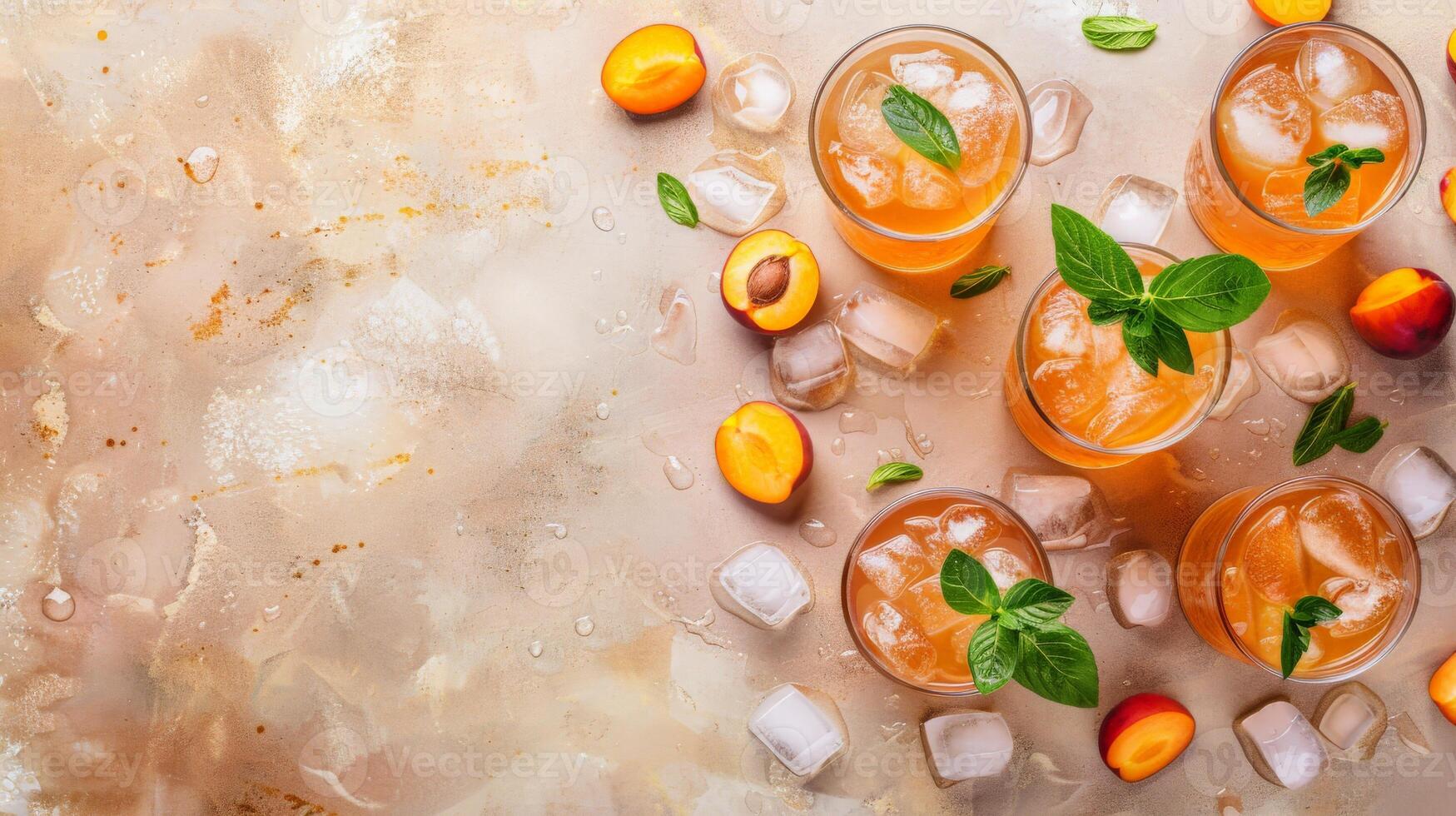Icy apricot nectar with mint garnish and ice cubes on a rustic background photo