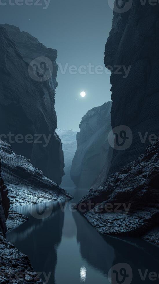 A peaceful river flows through a canyon lit by the moon photo