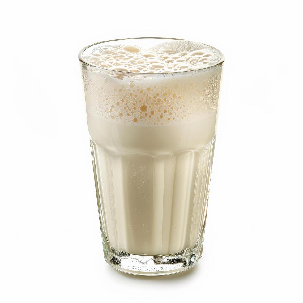A tall glass filled with refreshing buttermilk, ready to be enjoyed on a warm summer day photo