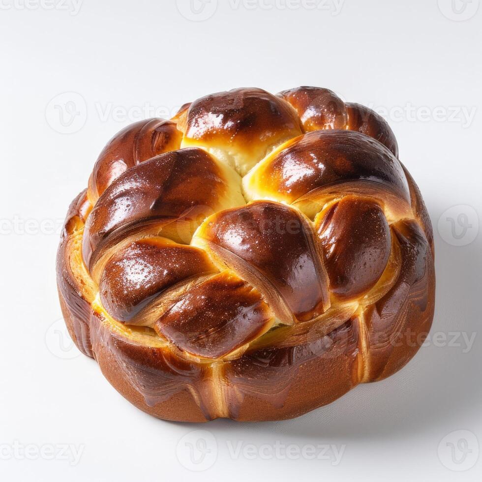 A freshly baked brioche loaf, its golden crust glistening under the studio lights photo
