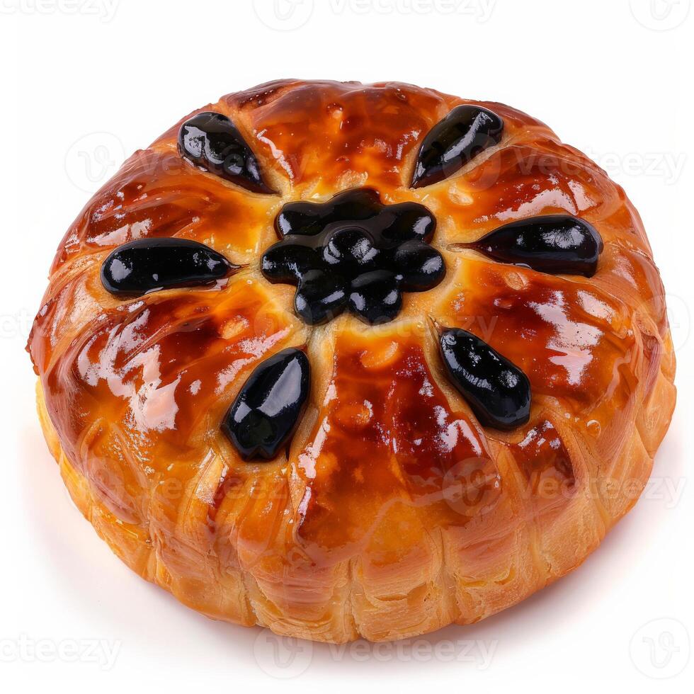 A freshly baked Eccles cake with a glossy crust and a generous filling of blackcurrants photo