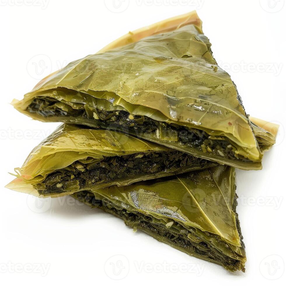 Three slices of Spanakopita, a Greek pastry filled with spinach and feta cheese photo