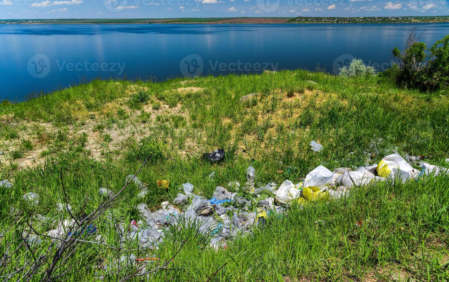 Environmental problem, pollution of the shores of a reservoir with construction and plastic waste, Khadzhibey estuary photo