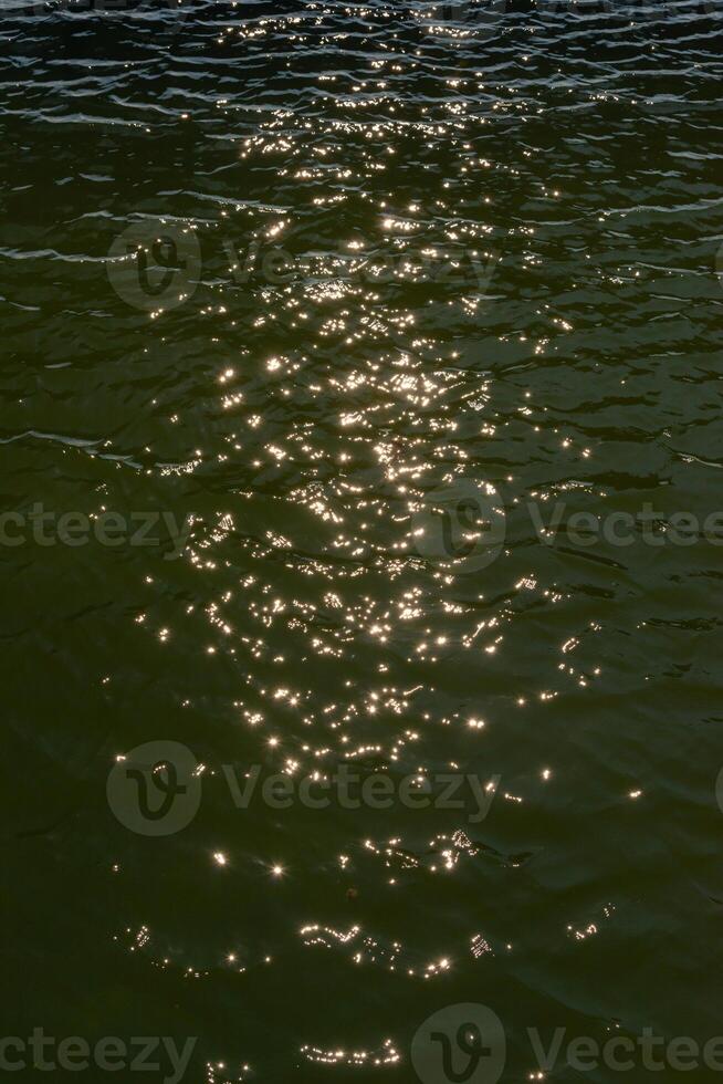 Reflection of the sun and glare in the water of the Tiligul estuary canal, Ukraine photo