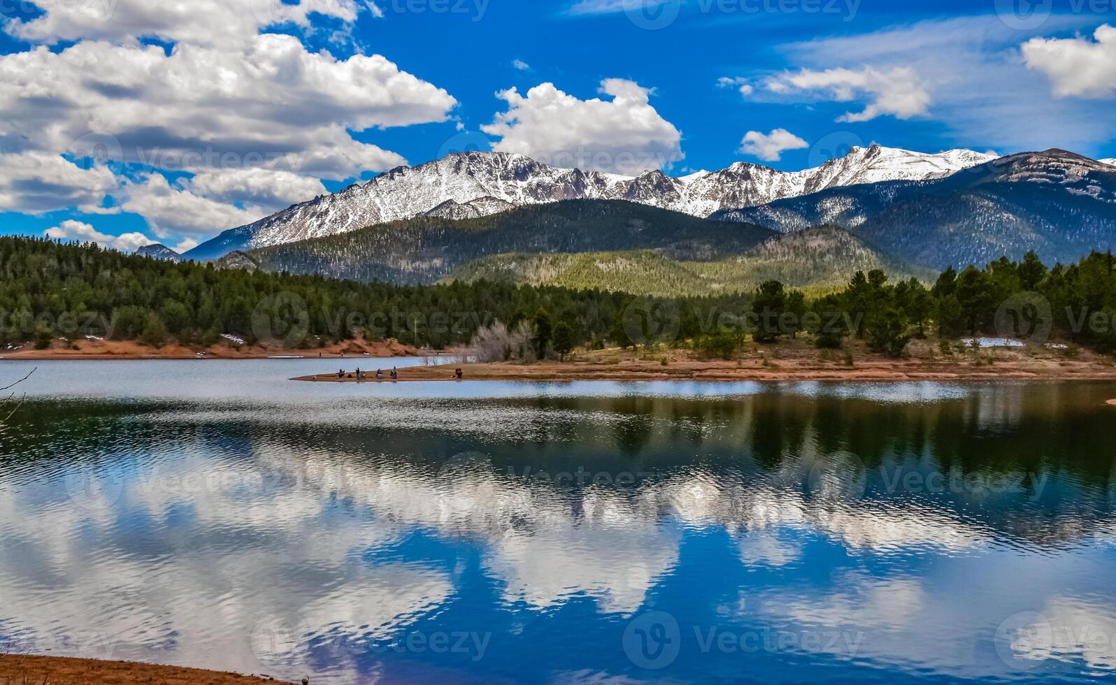 Panorama Snow-capped and forested mountains near a mountain lake, Pikes Peak Mountains in Colorado Spring, Colorado, US photo