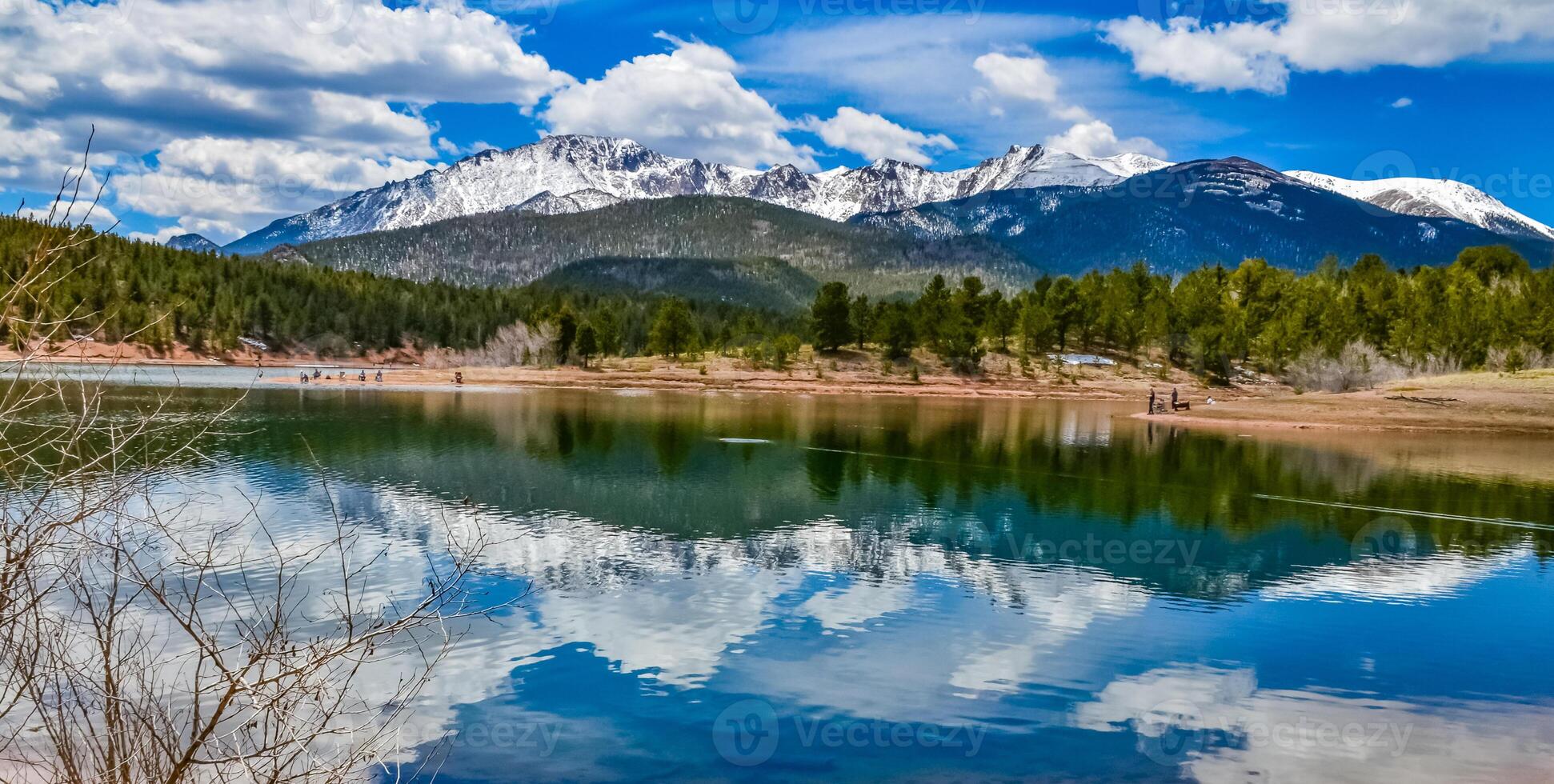 Panorama Snow-capped and forested mountains near a mountain lake, Pikes Peak Mountains in Colorado Spring, Colorado, US photo
