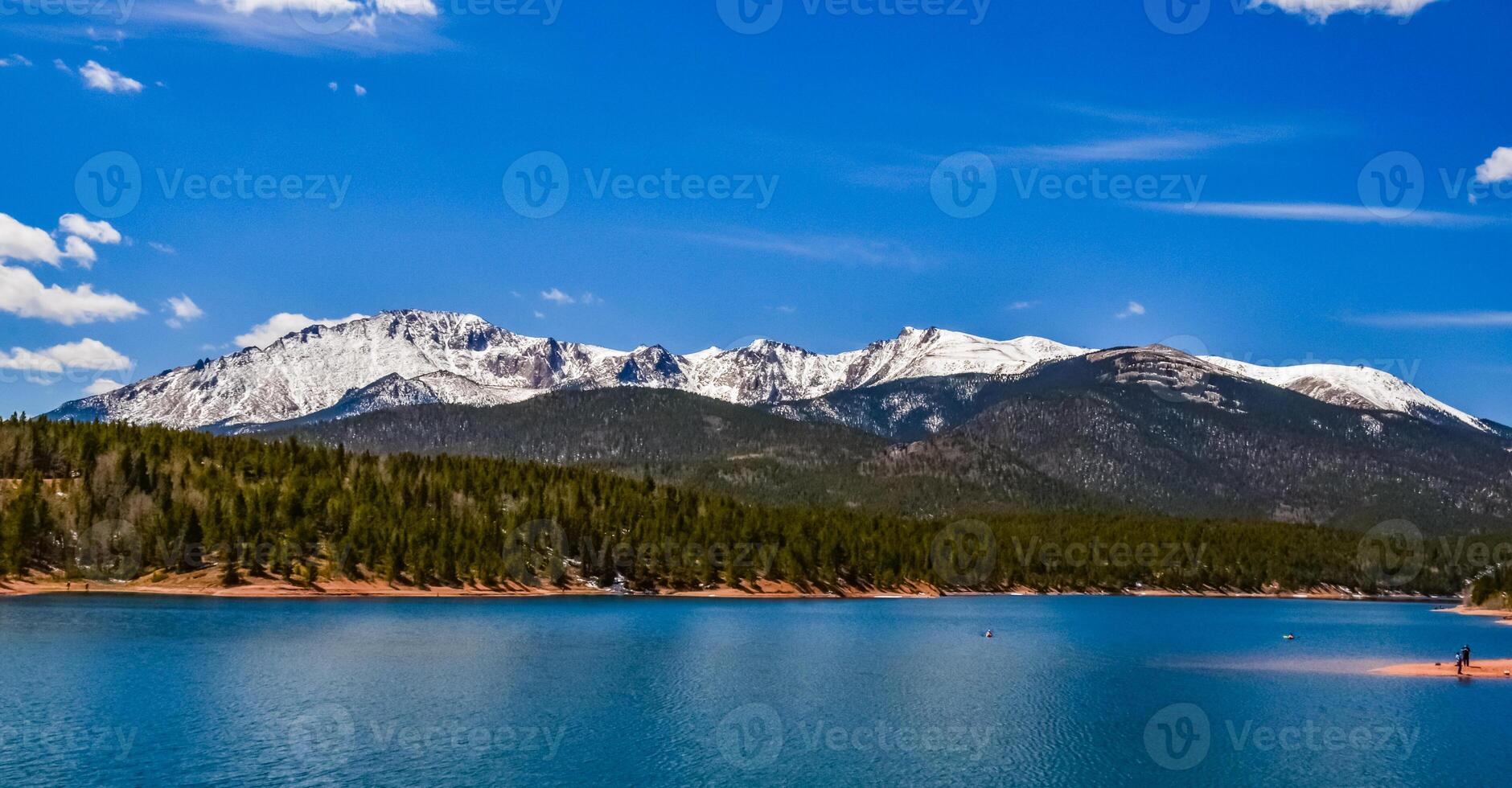Panorama Snow-capped and forested mountains near a mountain lake, Pikes Peak Mountains in Colorado Spring, Colorado, US photo